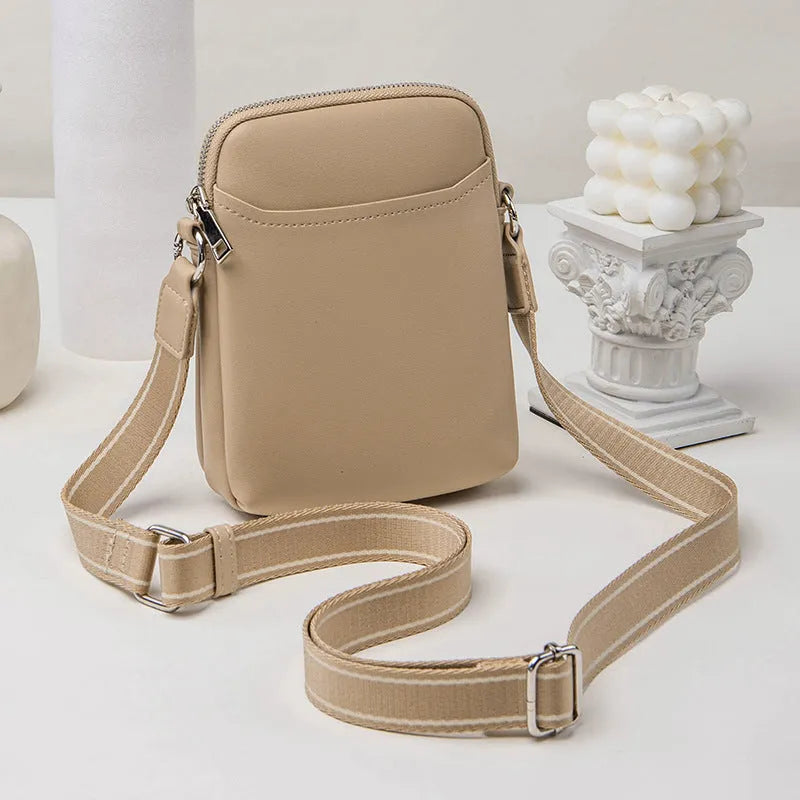 Small solid colour crossbody phone bag for women in beige.