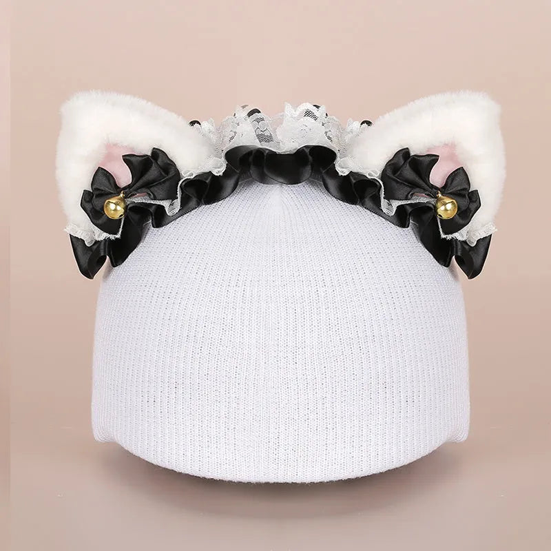 Colourful plush cartoon hat decoration sitting on top of a ski helmet
