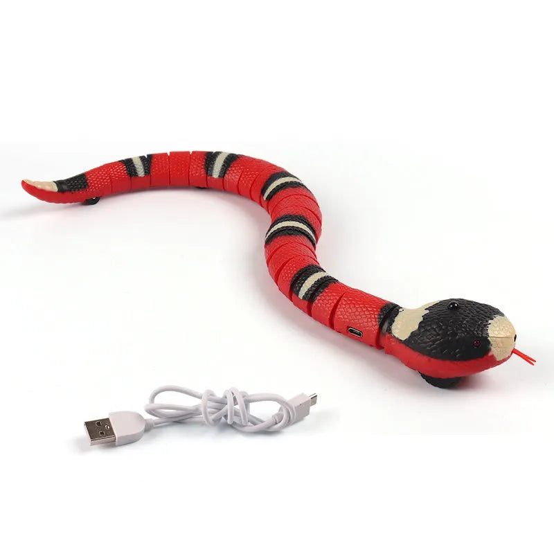 Smart sensing interactive snake cat toy with segmented plastic body and USB charging
