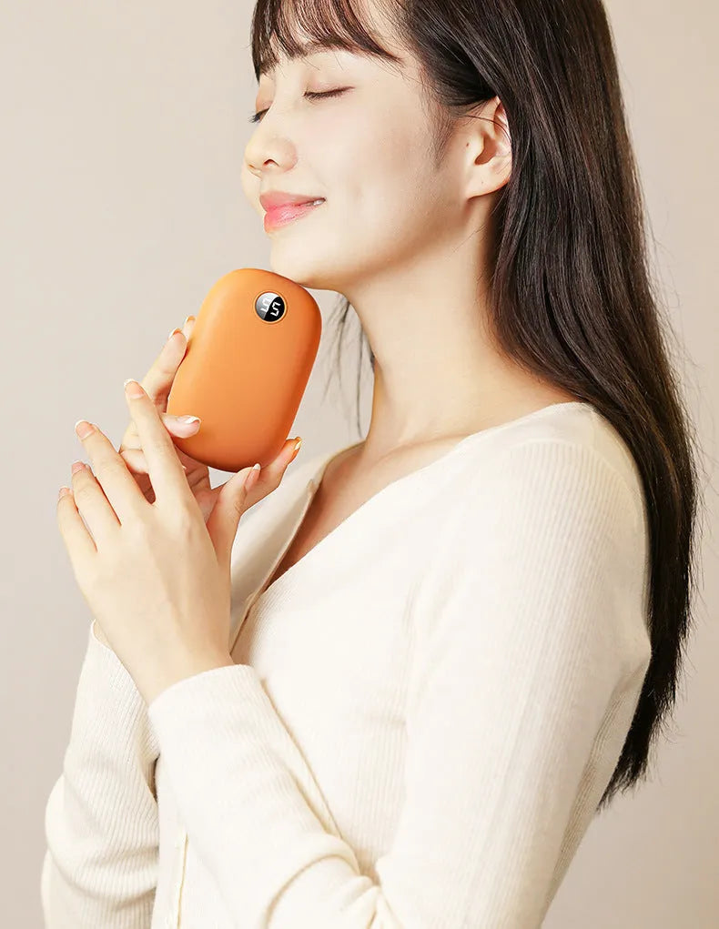 Two-in-one hand warmer and USB power bank, 11.5x7x2.6cm, in milky white, pink or warm orange