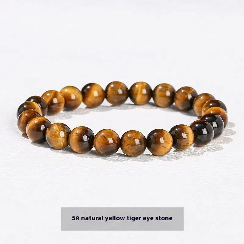 Natural tigereye crystal bracelet with yellow tiger eye beads approximately 8mm diameter on elastic cord