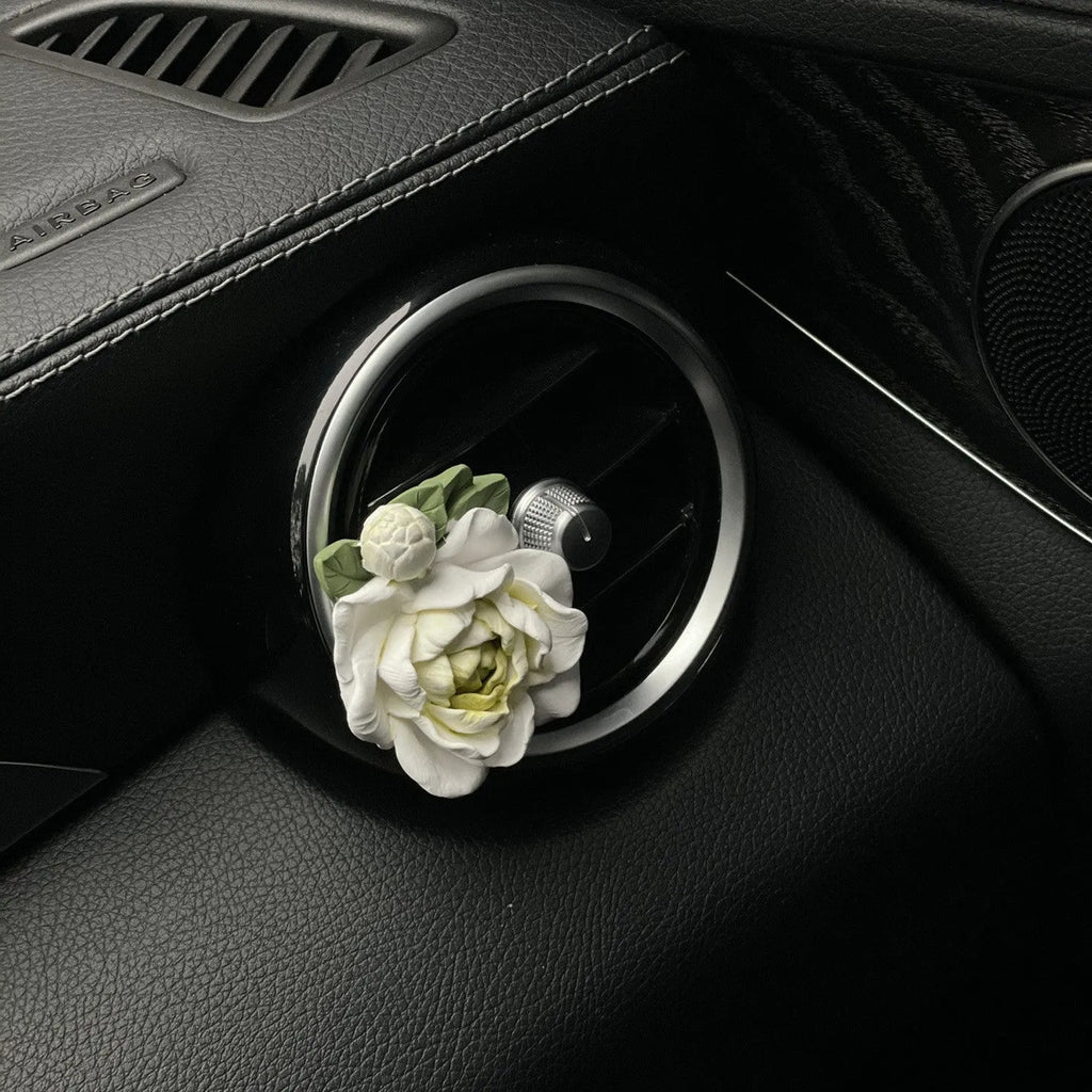 Jasmine car perfume solid gypsum diffuser measuring 5 by 4.5 centimetres with essential oil bottle