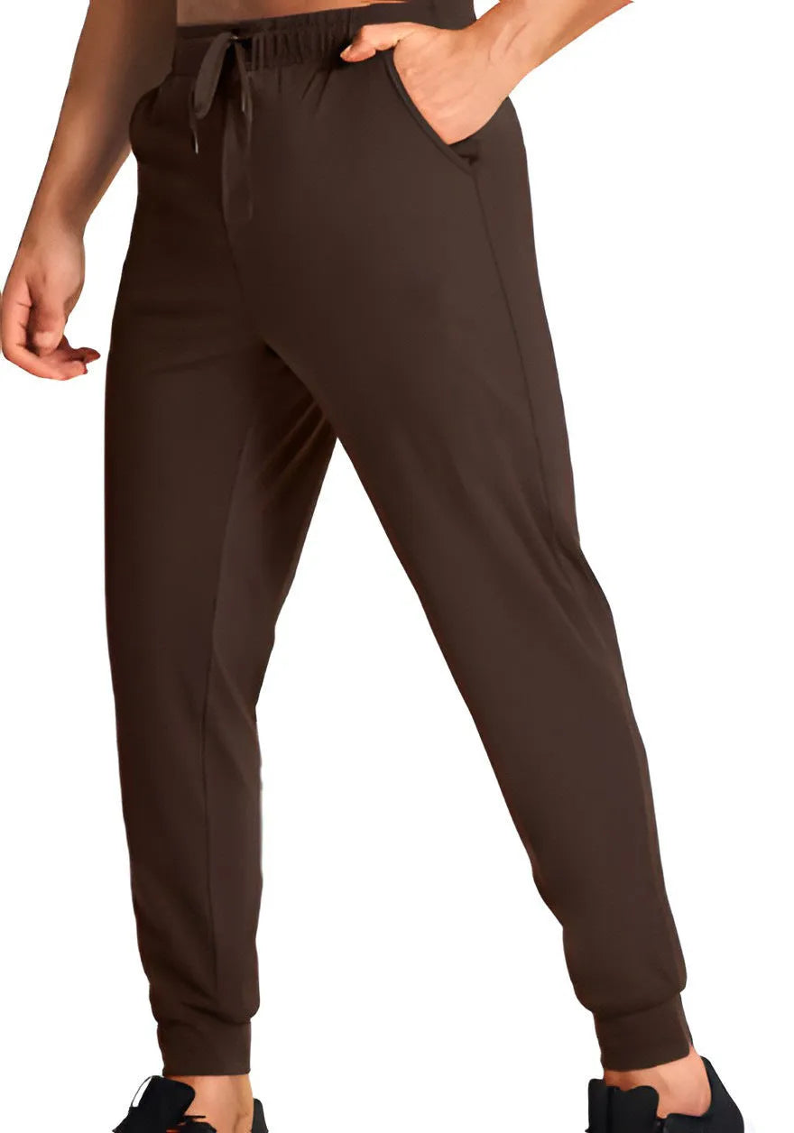 Man wearing loose-fitting solid colour casual trousers in a leisure setting.