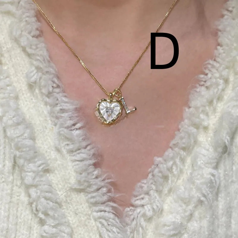 Women's pendant necklace with titanium steel chain and natural mother-of-pearl in heart-shaped design