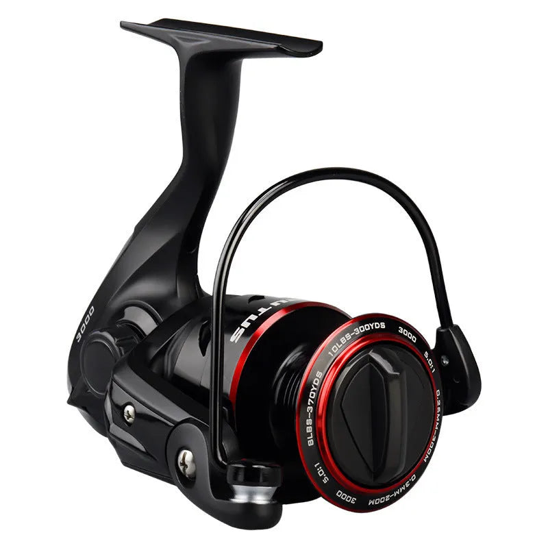 All-metal fishing reel attached to telescopic fishing rod in collapsed position