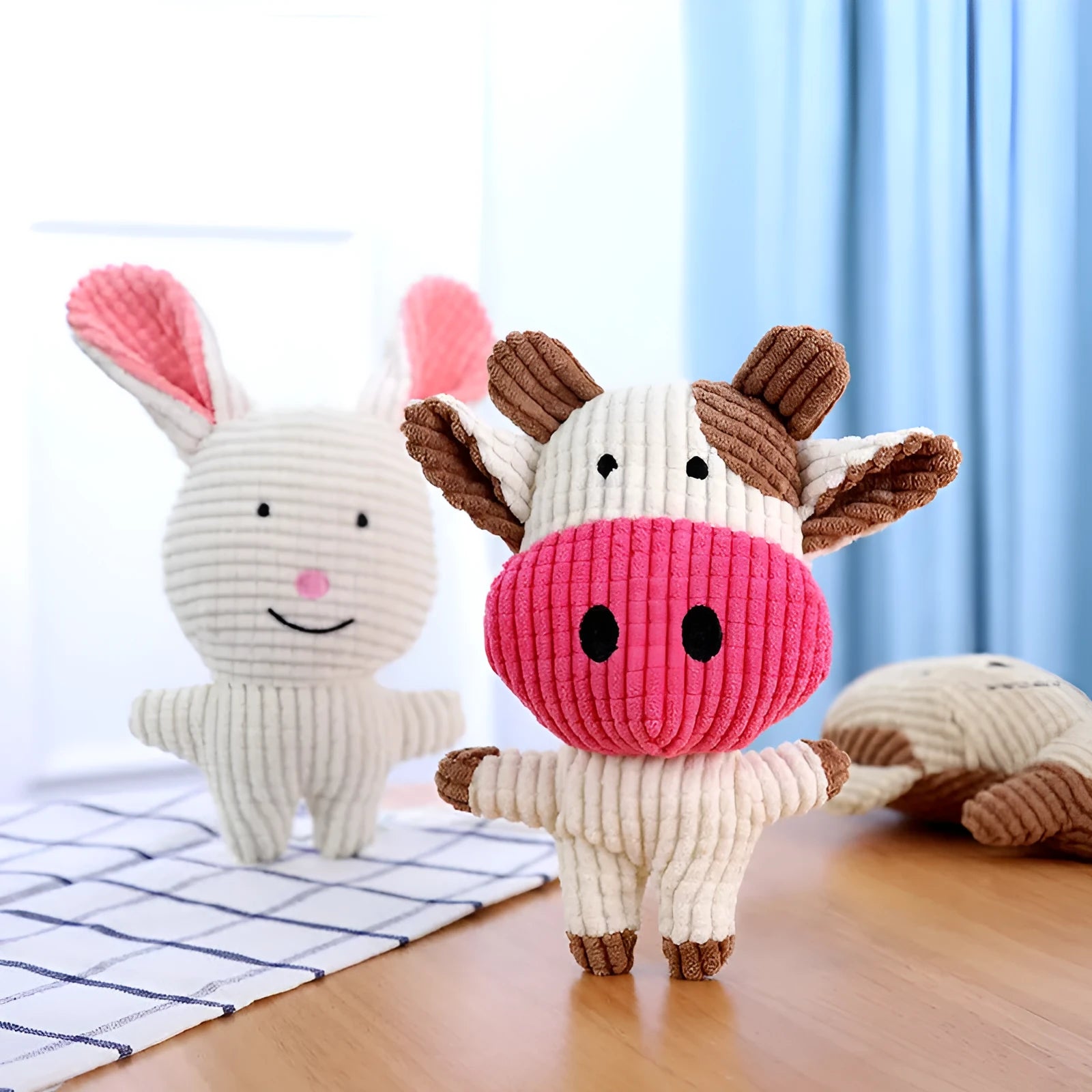 Animal shape plush squeaky dog toys in bright colours with bite-resistant construction