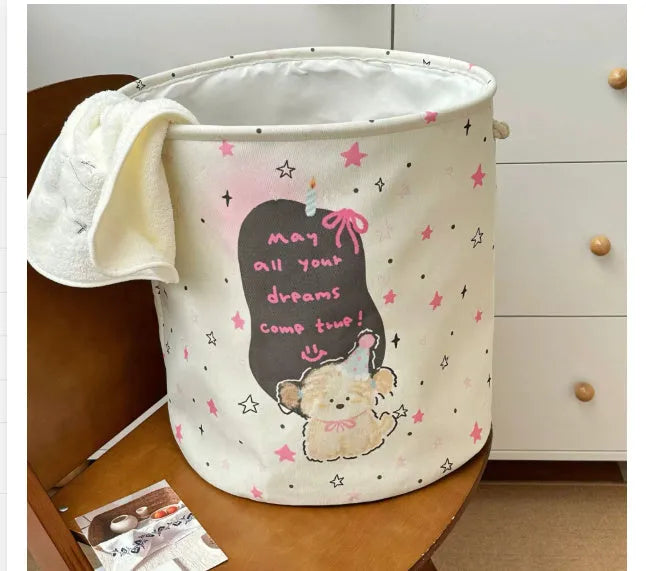 Foldable cotton cloth laundry basket in a character print colour, shown unfolded for use.