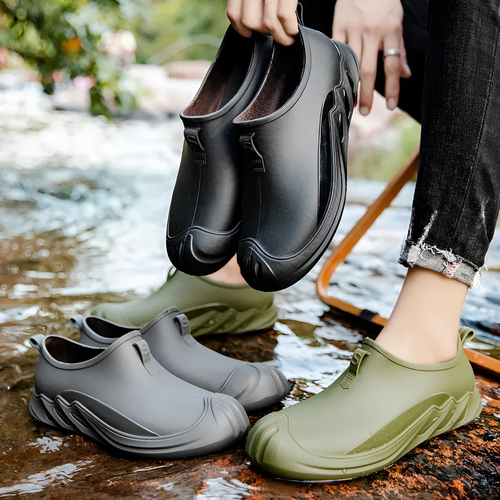 Men's short plastic rain boots in black on white background