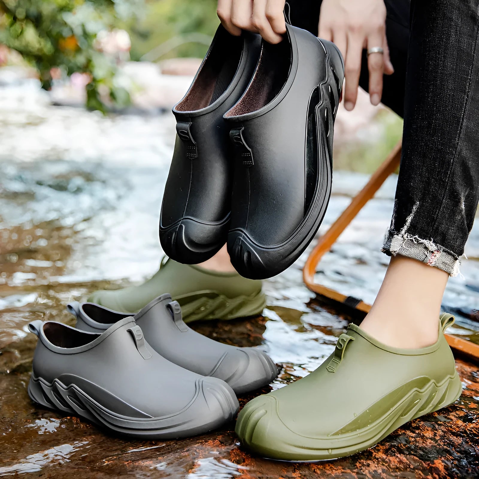 Men's short plastic rain boots in black on white background