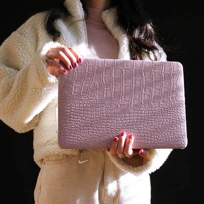 Pink MacBook protective case with bubble pattern and colourful stickers, compatible with 11-inch to 16-inch models.