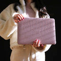 Pink MacBook protective case with bubble pattern and colourful stickers, compatible with 11-inch to 16-inch models.