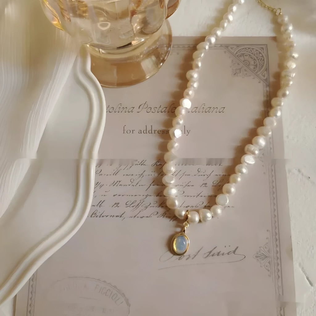 French Court style vintage pearl necklace with geometric alloy pendant on an adjustable chain.
