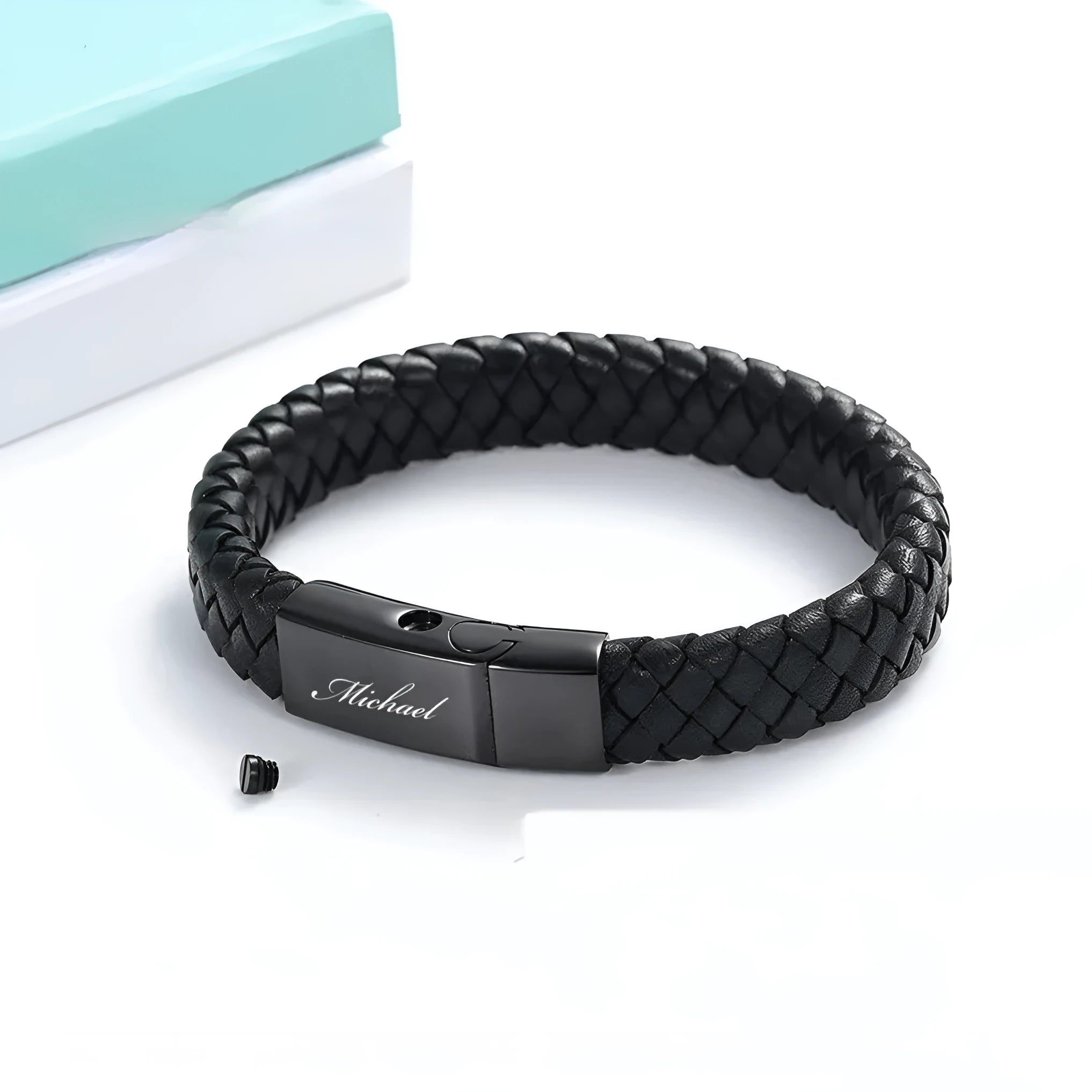Men's black woven leather bracelet with a stainless steel casket capsule for remembrance.