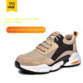 Black labour safety shoe with mesh breathable Flyknit upper and soft PU sole, shown on a work site background.