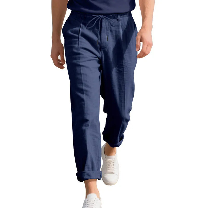 Men's straight-leg linen trousers in light khaki with a drawstring waistband.