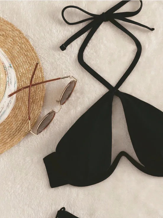 Women's brown halter neck bikini set with brief bottoms on a mannequin.