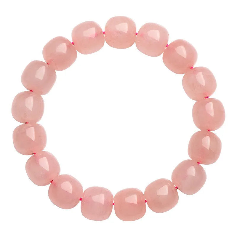 Pink natural crystal bracelet with 8x10mm barrel-shaped beads on a cord.