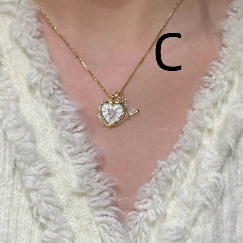 Women's pendant necklace with titanium steel chain and natural mother-of-pearl in heart-shaped design