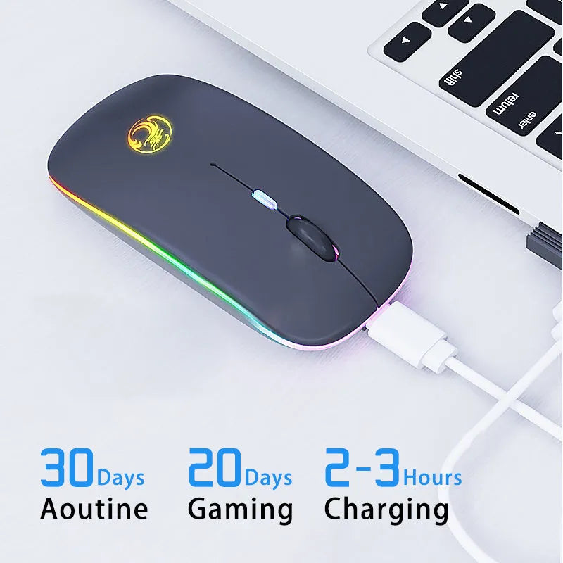 White luminous wireless mouse with glowing blue scroll wheel on a wooden desk