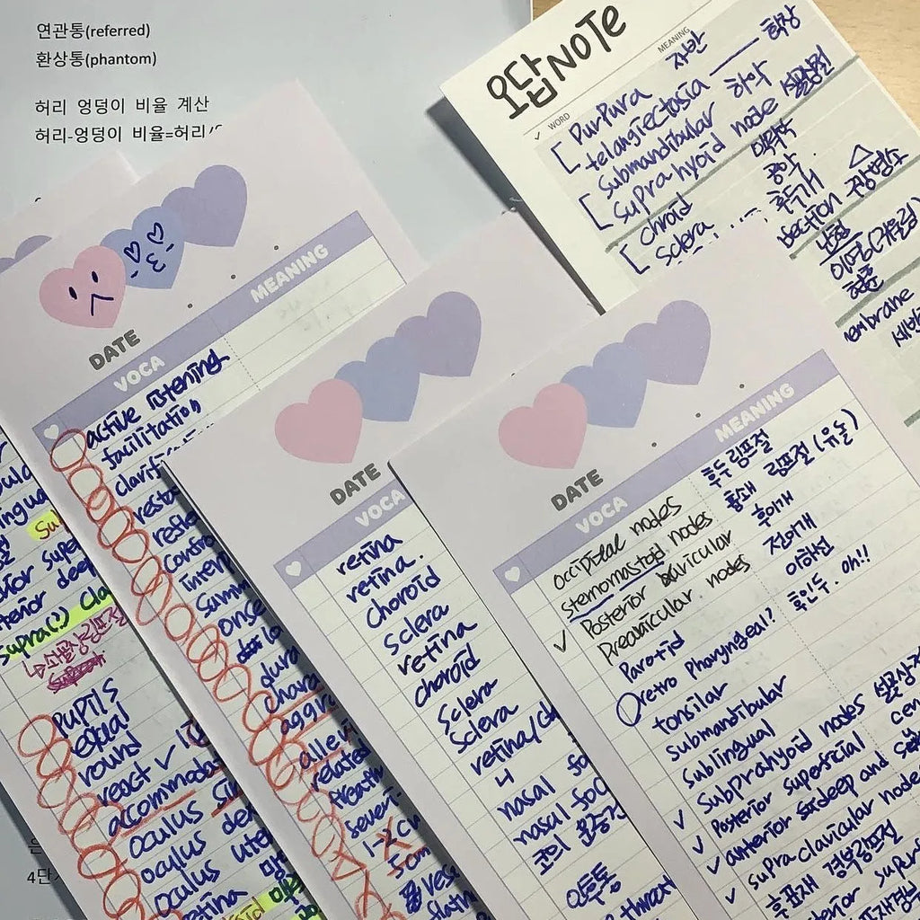 Half-B5 size vertical notepad with coloured cover, shown open to show lined pages.