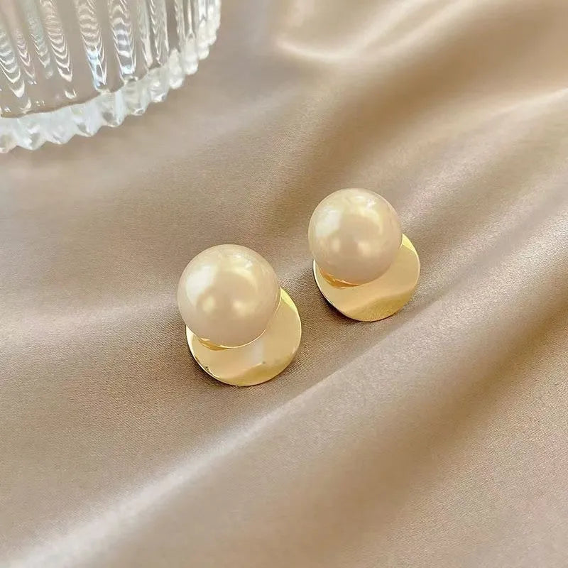 Fashionable alloy round drop earrings in gold tone, 1.2 cm diameter, on a white background