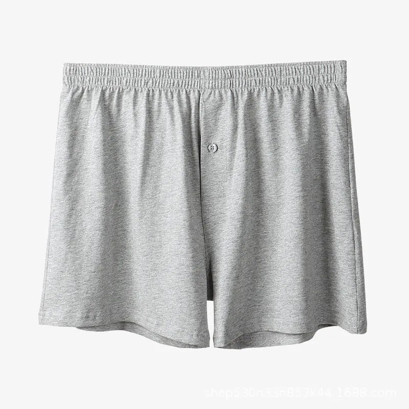 Men's light grey high-waist cotton loose boxer shorts laid flat.