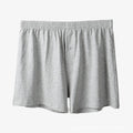 Men's light grey high-waist cotton loose boxer shorts laid flat.