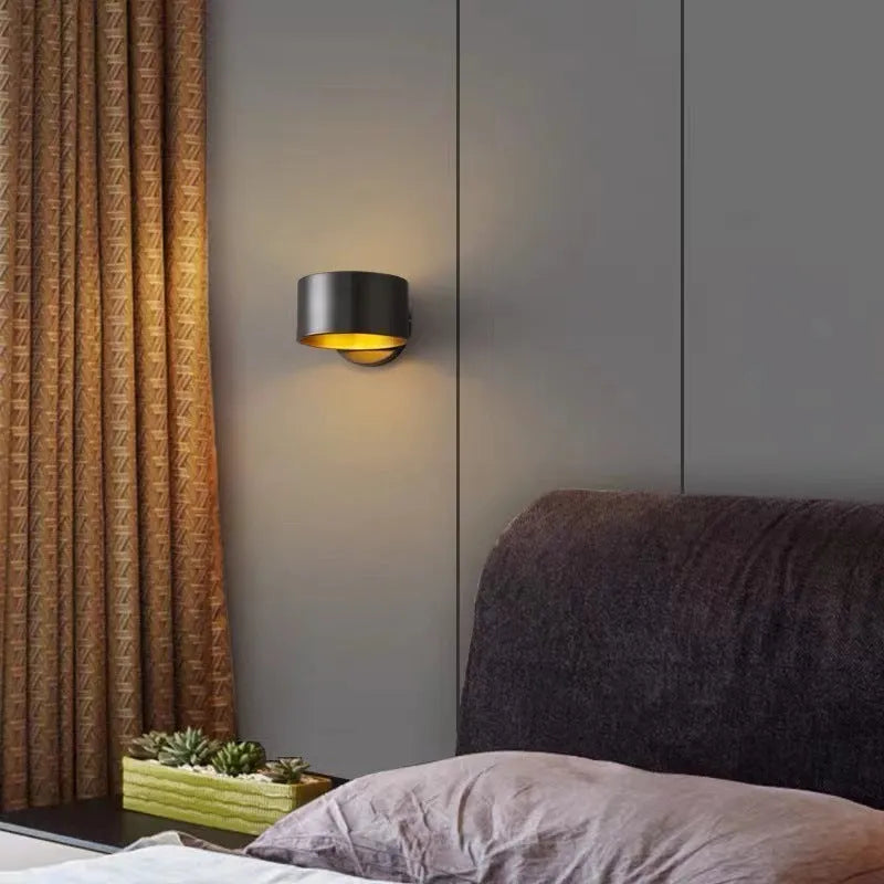 Modern wall lamp with a copper-colour finish, shown in black and gold options.