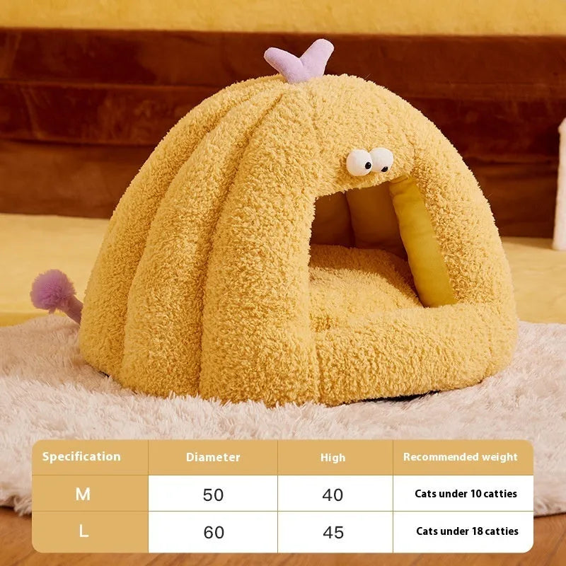 Green monster-shaped semi-enclosed cat kennel bed for small cats on a floor.