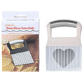 Stainless steel potato wave knife for making crinkle-cut chips on a wooden board.