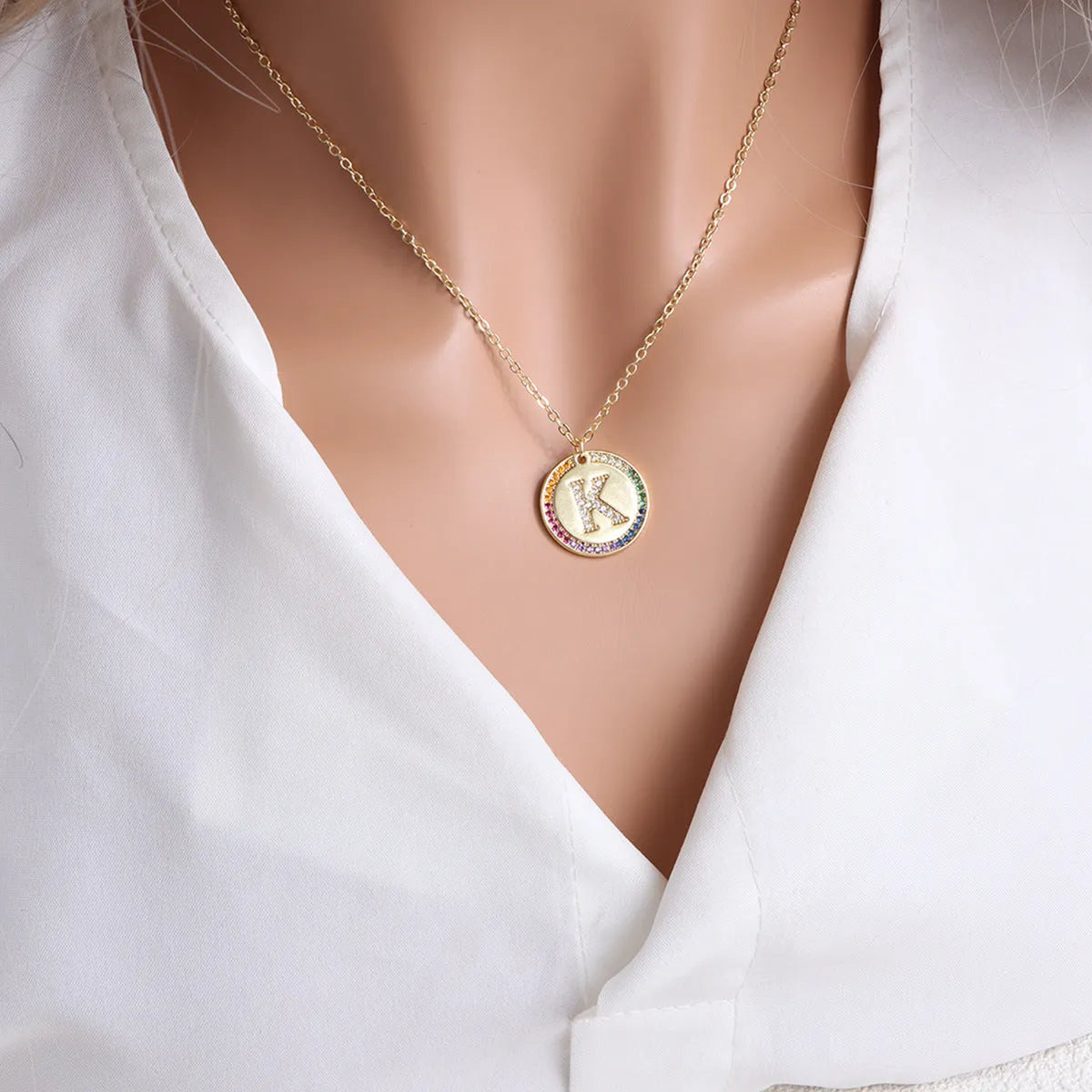 Gold English letter round pendant necklace with colourful crystals on clavicle length chain