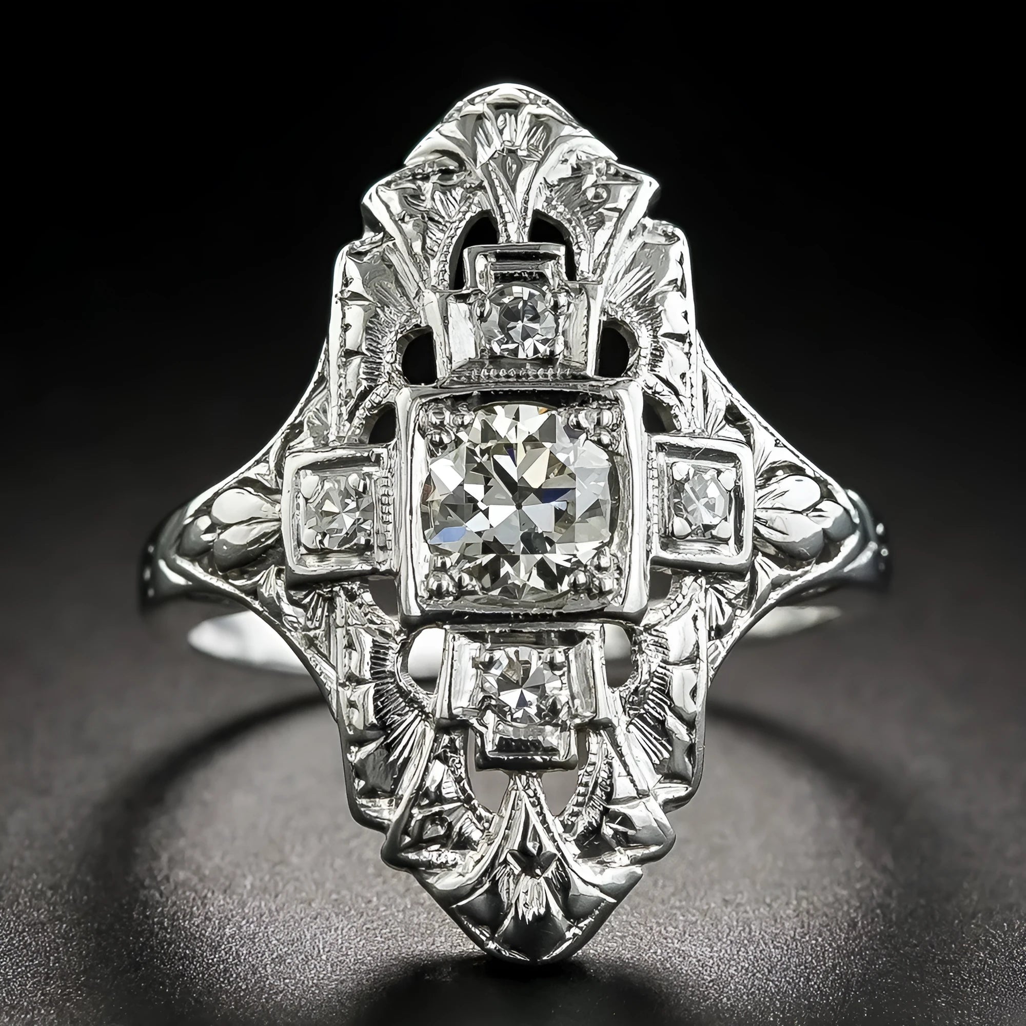 Hollow geometric silver-coloured ring with diamond studs on copper base