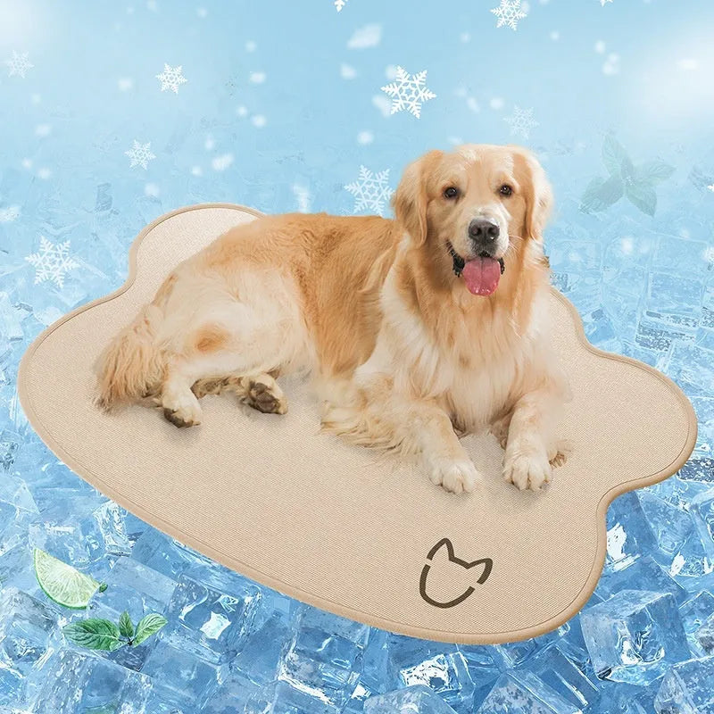 Ice silk dog cooling mat with simple dog head shape print, shown in a light grey colour on a wooden floor.
