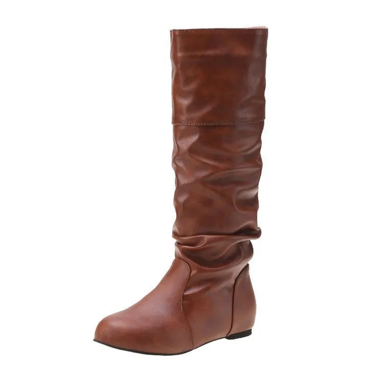 Women's flat ankle boots in black with a round toe, slip-on design, and high cylinder sock.