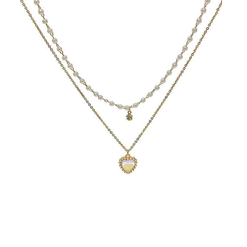 Gold-tone zinc alloy double-layer necklace with heart-shaped pendant and adjustable 21-50cm regular chain for women.