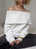 Grey off-the-shoulder women's sweater with a 3D textured pattern.