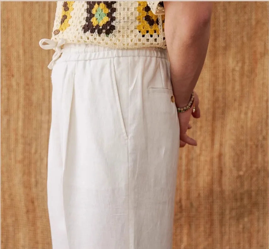 Women's linen high-waist trousers with a loose straight-leg cut and elasticated waistband in greige.