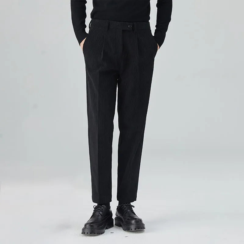 Men's straight-leg corduroy trousers in black, beige, and brown grey colours showing loose fit and textured fabric
