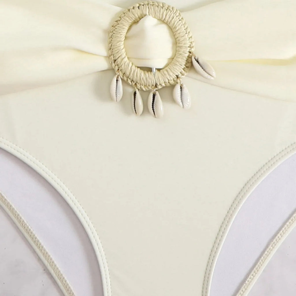 Women's split bikini swimsuit with tassel detail, backless design, nylon and polyester fabric, sizes S to XL