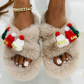 Women's black faux plush slippers designed like a Christmas hat with a rubber sole.