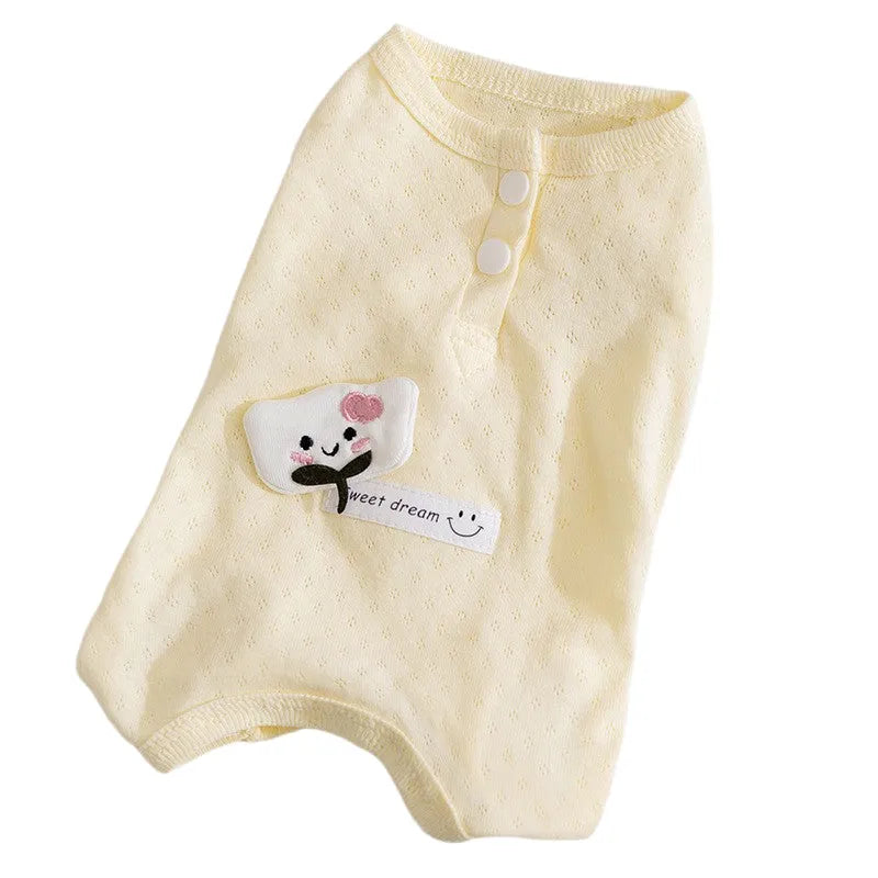 Soft yellow mesh pet shirt with cartoon cat patch and button closure on a small dog or cat