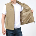 Man wearing a striped khaki waterproof hooded vest coat with multiple patch pockets.