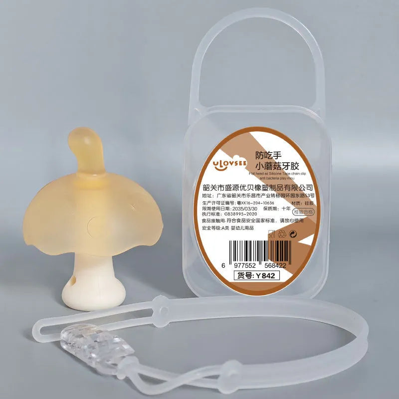 Small pink mushroom-shaped latex chewing gum in a transparent box with a chain.