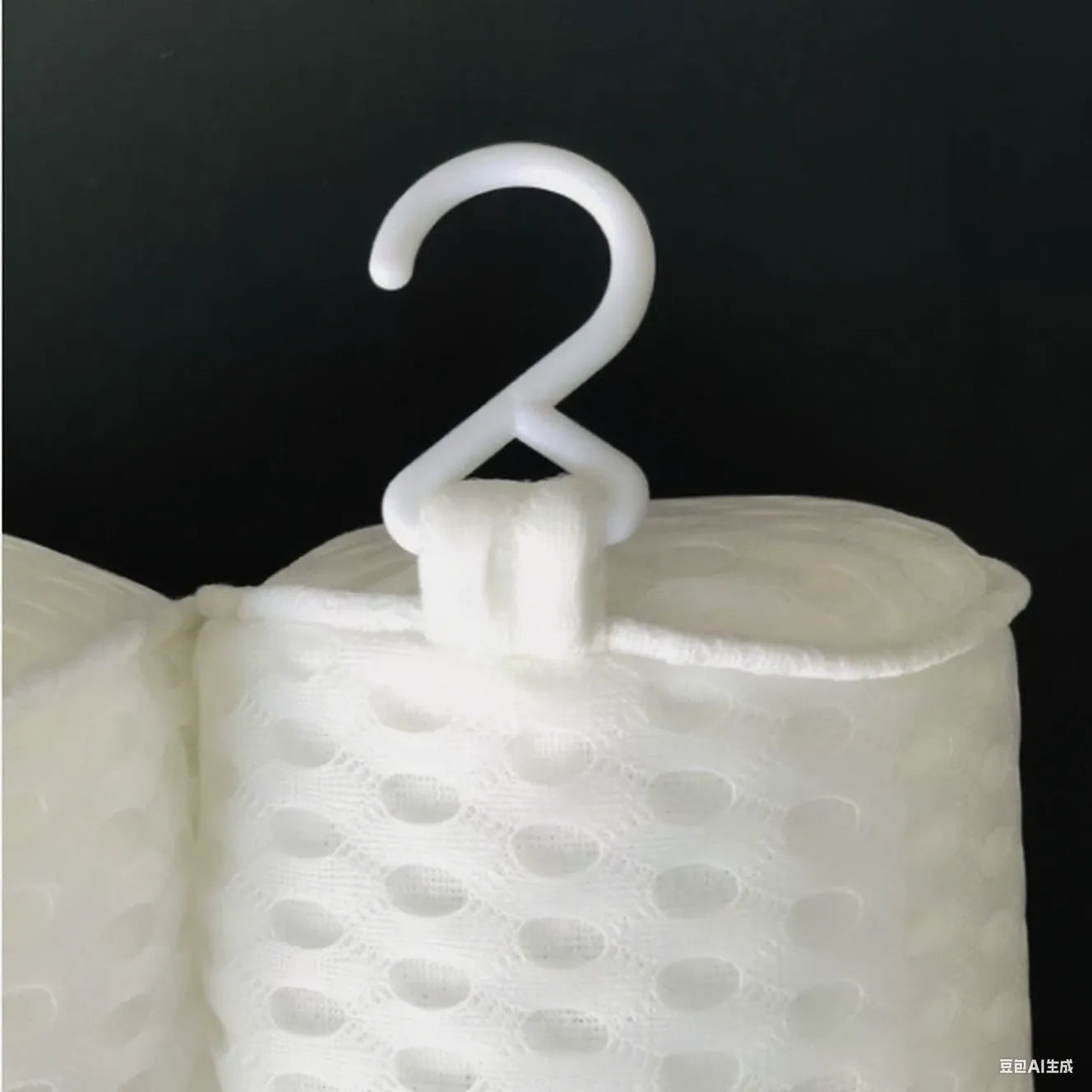 White adult bathtub pillow with 4D mesh material and suction cups on a bath mat.