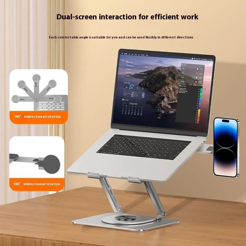 Silver carbon steel laptop stand with rotating magnetic phone holder mounted beside 17-inch laptop
