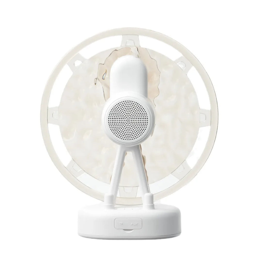 Pink and white Bluetooth speaker projecting colourful Ferris wheel and water ripple LED light patterns
