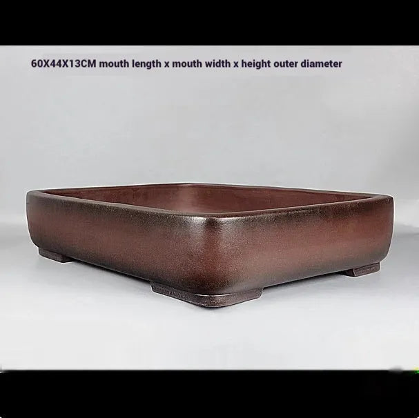 Handmade antique rectangular purple clay flower pot showing its size and shape.