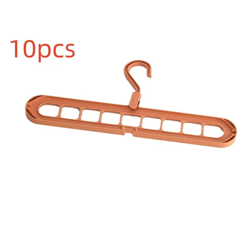 Multifunctional plastic hanger with nine holes for folding trousers, shown in beige