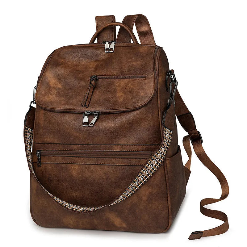 Solid-colour university backpack in PU leather with curved shoulder straps and minimalist stitching detail