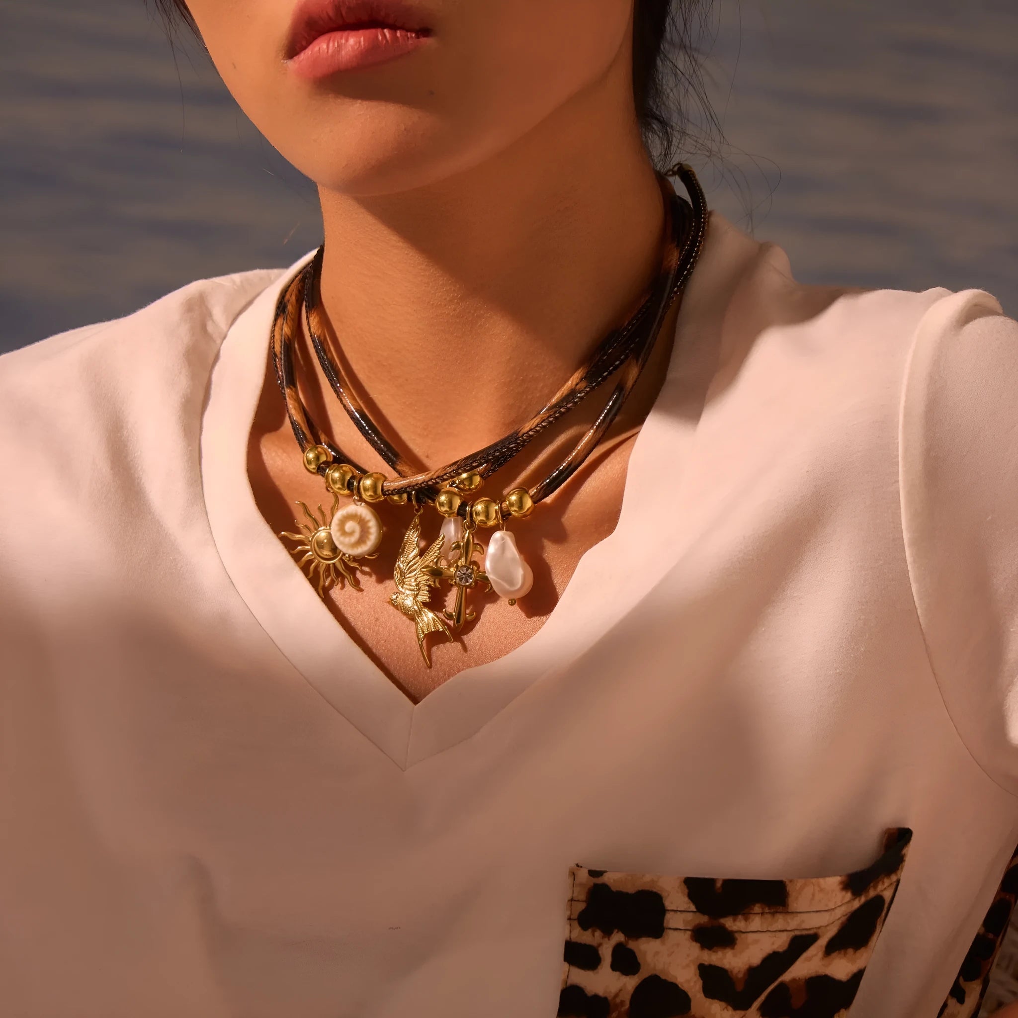 Geometric leopard pendant necklace on adjustable chain with 18K gold electroplated finish
